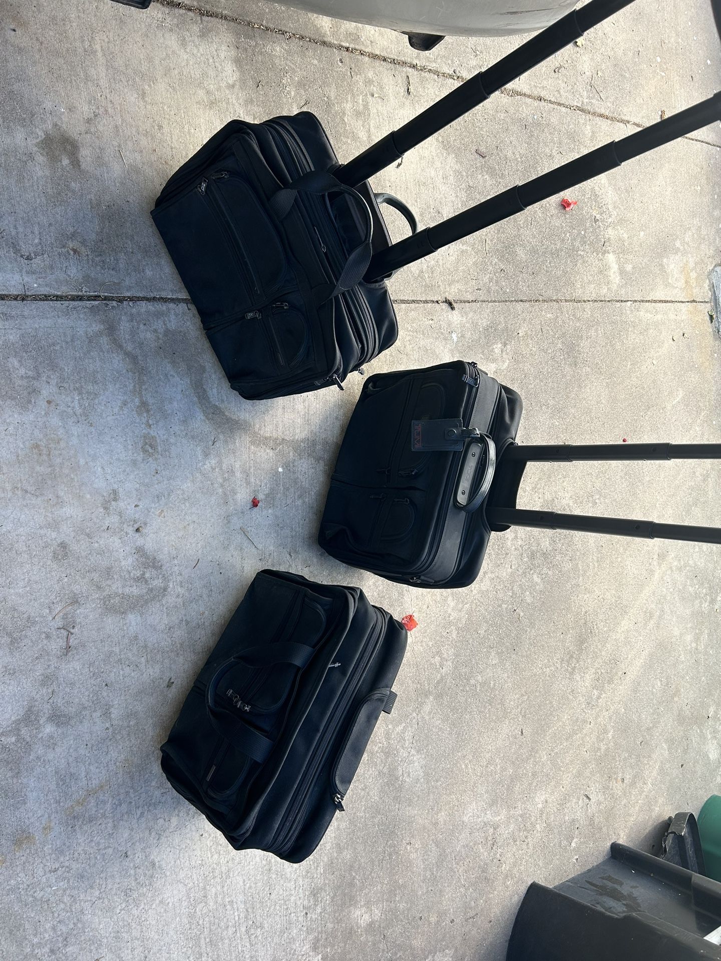 TUMI Rolling Briefcases In Excellent Condition 
