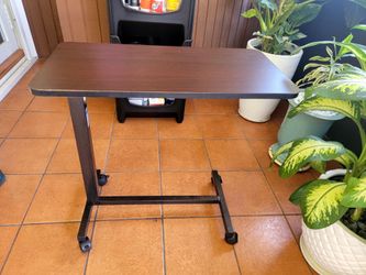 Adjustable multi-level side table with locking casters designed for medical use a portable table for use w a bed, sofa or while standing. Maximum H 45