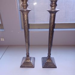 Hammered metal candlesticks pair
Textured hammered metal candlesticks. This is a pair of silver-tone candle holders. They are metal and have a cool ha