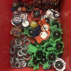 Huge Beyblade Lot – 30+ Tops, Launchersts (Used)  Price: $60  Description: Selling a big lot of Beyblades with launchers and extra parts.