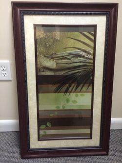 Brown frame boat painting