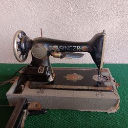 Antique Singer Sewing Machine fitted with working electric motor with footpedal.