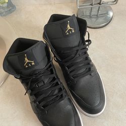 Black And gold Jordan Ones 