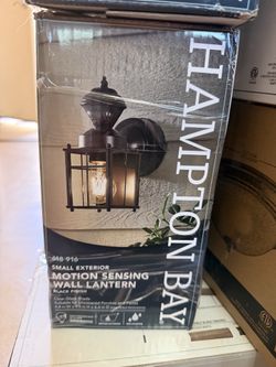 Small, exterior, motion sensing wall lantern