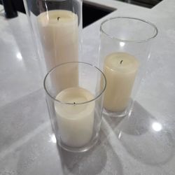 Tiered candles with glass cylinders