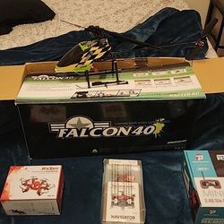 5 Drones and a radio controlled helicopter $75. One of the drones has a VR headset with its