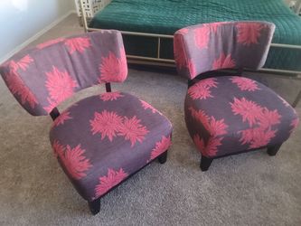 A pair of brown red accent chairs