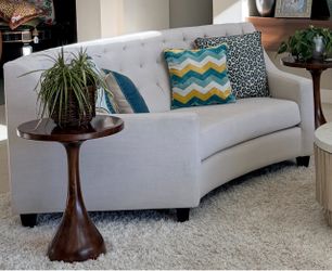 2 Curved tufted sofas