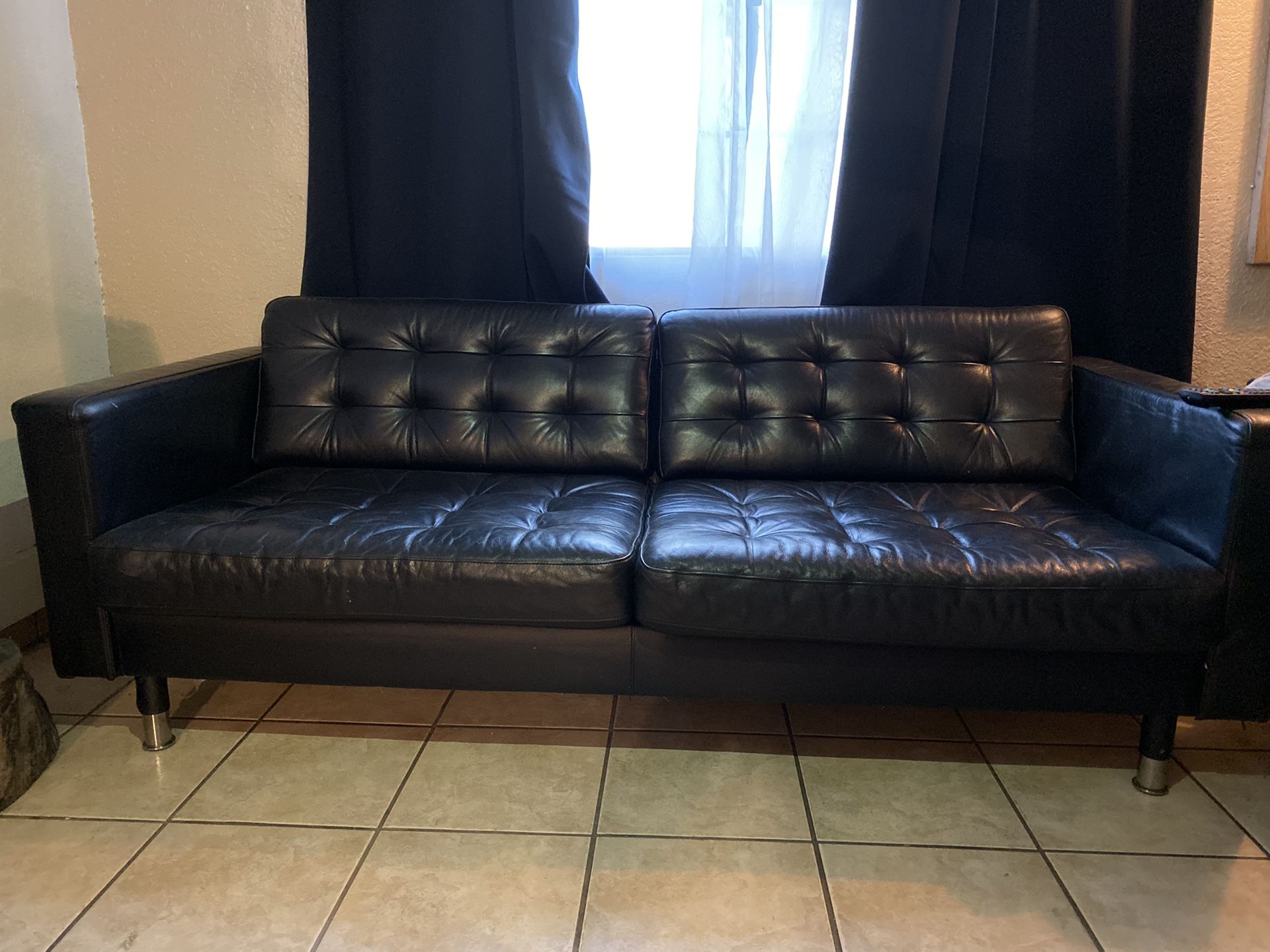 Black leather ikea couch