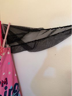 Black stuffed animal wall organizer