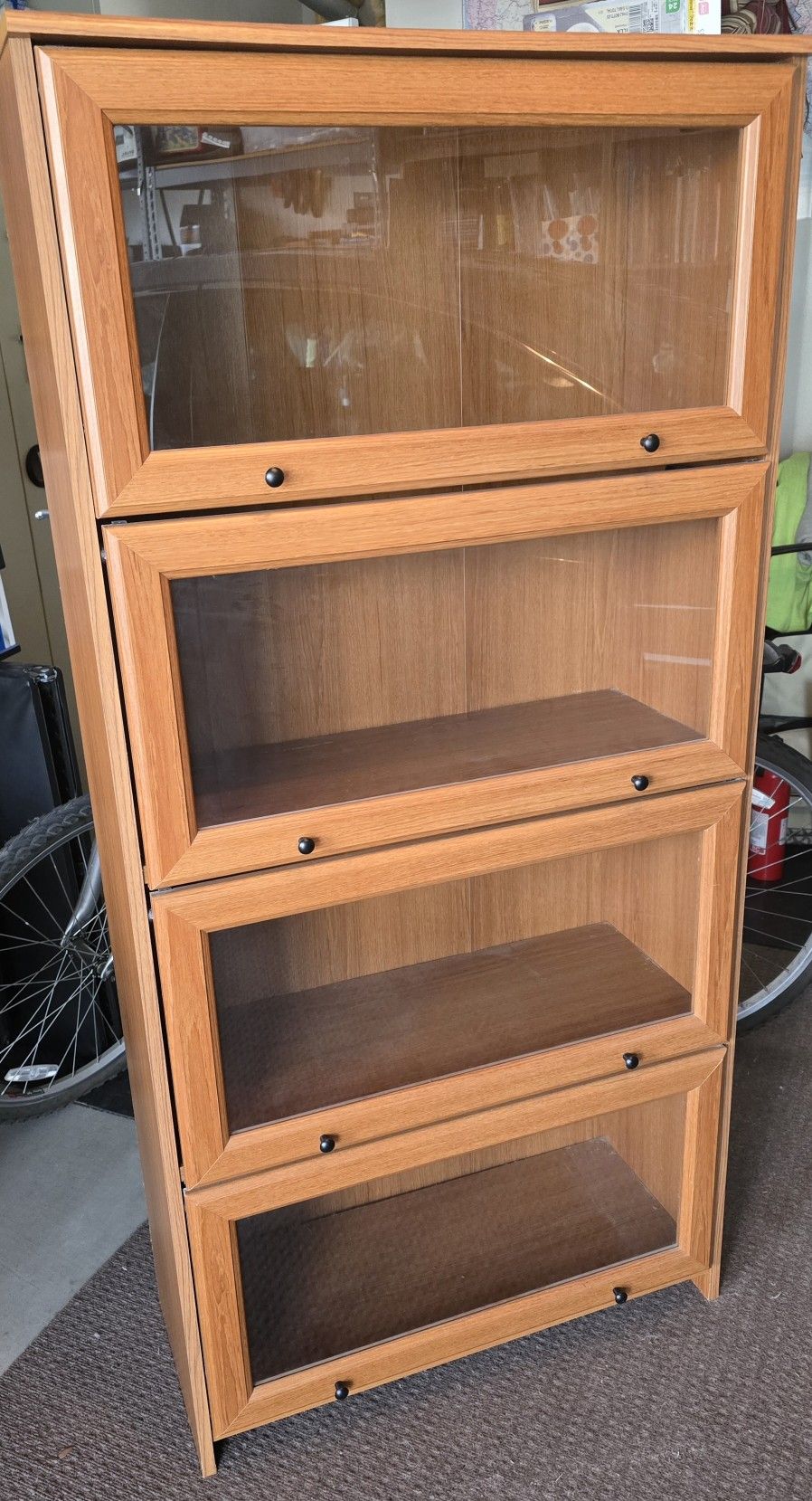 Wooden display cabinet with glass doors