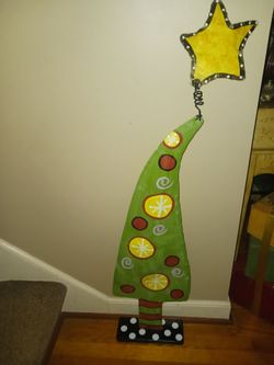 Tall primitive Christmas tree with star