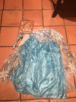 Authentic Disney brand Frozen Elsa costume. Comes with scepter and wig.