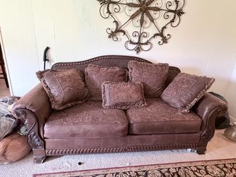 Traditional Brown Sofa with Carved Wood Frame
