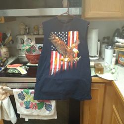 Mens Sleeveless T Shirt.  New. Size. Med. The Color Is Blue