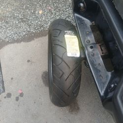 Brand new motorcycle.
 Tire.
 $100 firm on price.