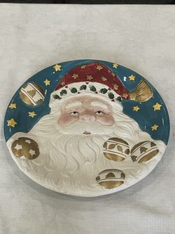 World Bazaars Hand-painted ceramic decorative plate featuring Santa Claus. 12”