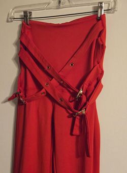A Pair Of  red leggings with belts