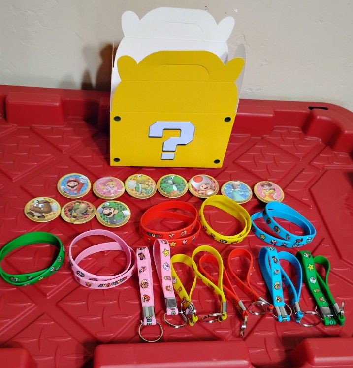 Super Mario buttons, Keychains and Rubber Bracelets lot W/Box 
