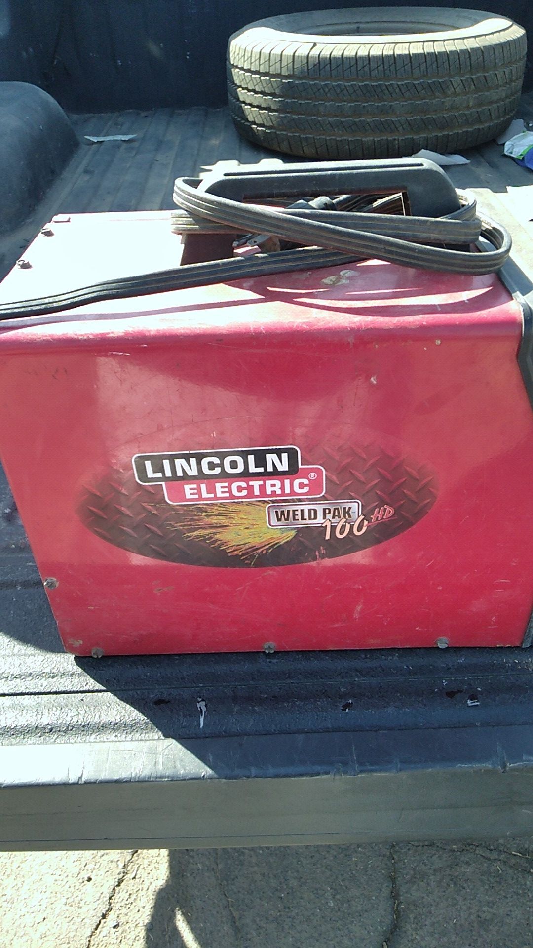 Lincoln electric weld pack hd 100 gas and regular welder with a miller mask and extra tips just missing the bolt and washer that hols the wire