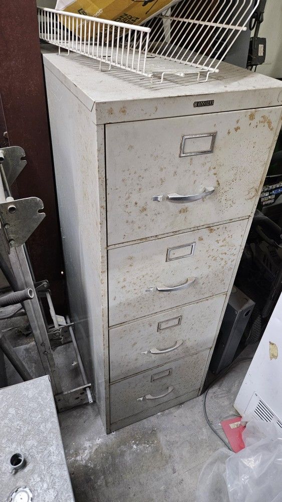 Four Drawer Steel Filing Cabinet About Five Feet Tall