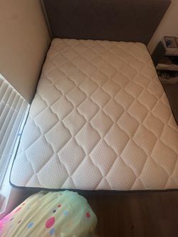 Queen size bed , headboard , and metal platform
