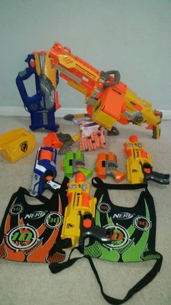 7 Nerf guns + 69 bullets + 2 bullet vest