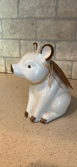 cute piggy statue with wings