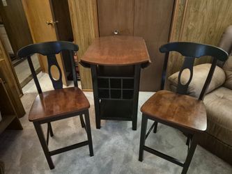 Solid wood chairs and table, table has wine rack, very good condition made in Vietnam