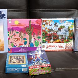 ASSORTED PUZZLES WITH PHOTO SHEET 3.00 PER BOX LIKE TO SEE AS A LOT used