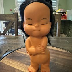 Vintage Hawaiian doll with eyes closed