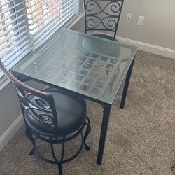 dining room set - two chairs and table with glass. 