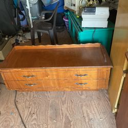 A wood chest it’s 16 inches tall 48 inches wide and 18 inches deep