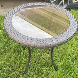 Wicker Glass Top Small Table Outside 