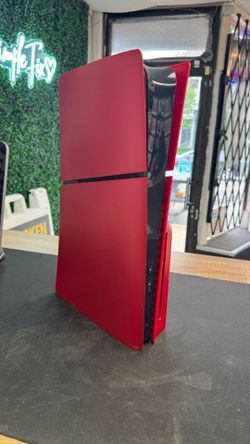 Red PS5 with controller