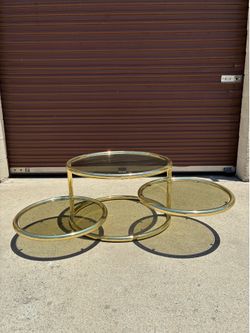 1980s Postmodern Sleek Milo Baughman Style Brass and Glass Swiveling Coffee Table