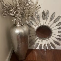Feathered mirror and decorative vase