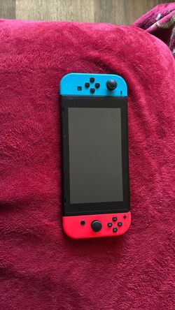 Nintendo Switch with Neon Blue and Neon Red Joy-Con comes with everything except the charger and the Joy-Con Straps i added  a      SANDISK - 128GB mi