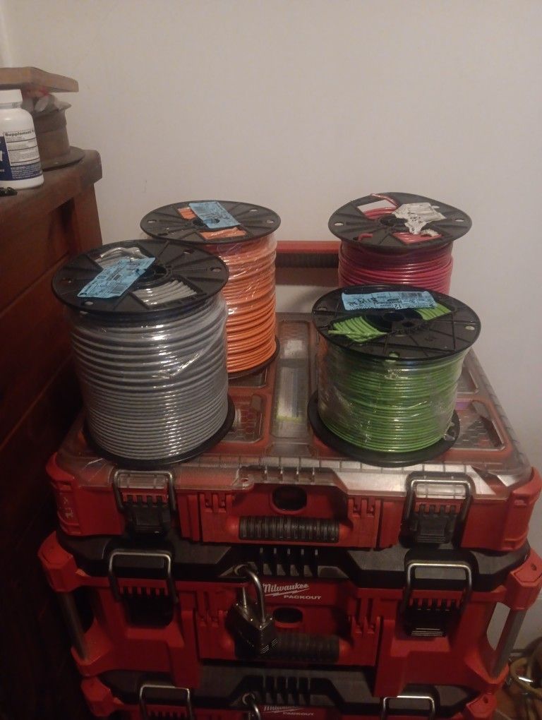Three 500ft. rolls #10 awg stranded copper wire consisting of one grey,one orange and one red. Also have one 500ft reel of green #12awg stranded coppe