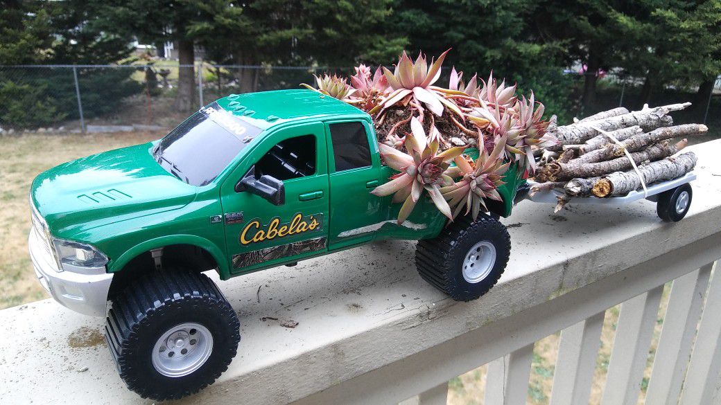 Cute truck planter with trailer.