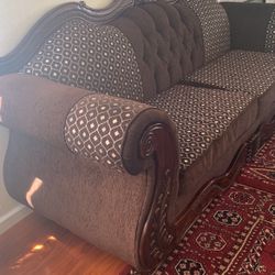 2 Large Couches And One Medium Couches Dark Brown And Has Wooden Features