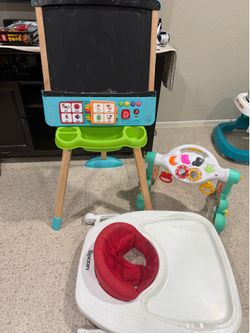 Interactive easel, baby walker and interactive play gym and push walker