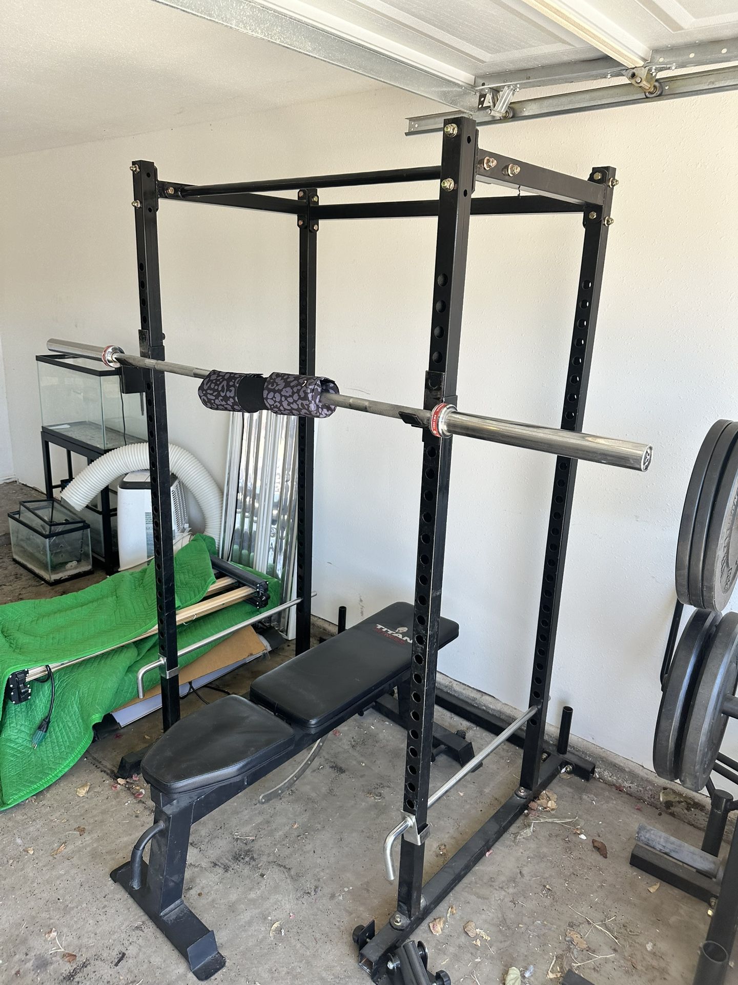 Titan Power Rack, Olympic Bar, And 320lbs Of Weight With Racks Included