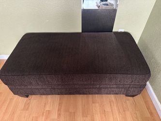 Brown couch w/pillow and matching ottoman