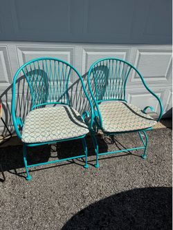 Teal patio chairs with cushions