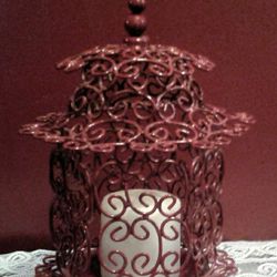 Very pretty red metal candle holder