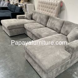 BRAND NEW! Sectional sofa with DOUBLE CHAISE.  Measures approx. 120" x 60". Upholstered in soft corduroy fabric. Available in black, dark grey or ligh