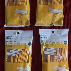 Four Packages Of Disposable Razors