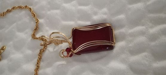 Red glass pendant gold plated wrapped with necklace handmade from art gallery showing