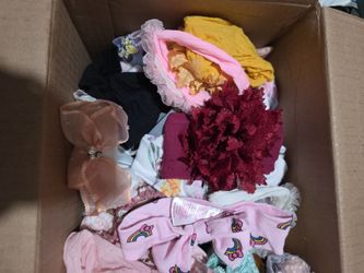 Diaper box full of baby girl head bands